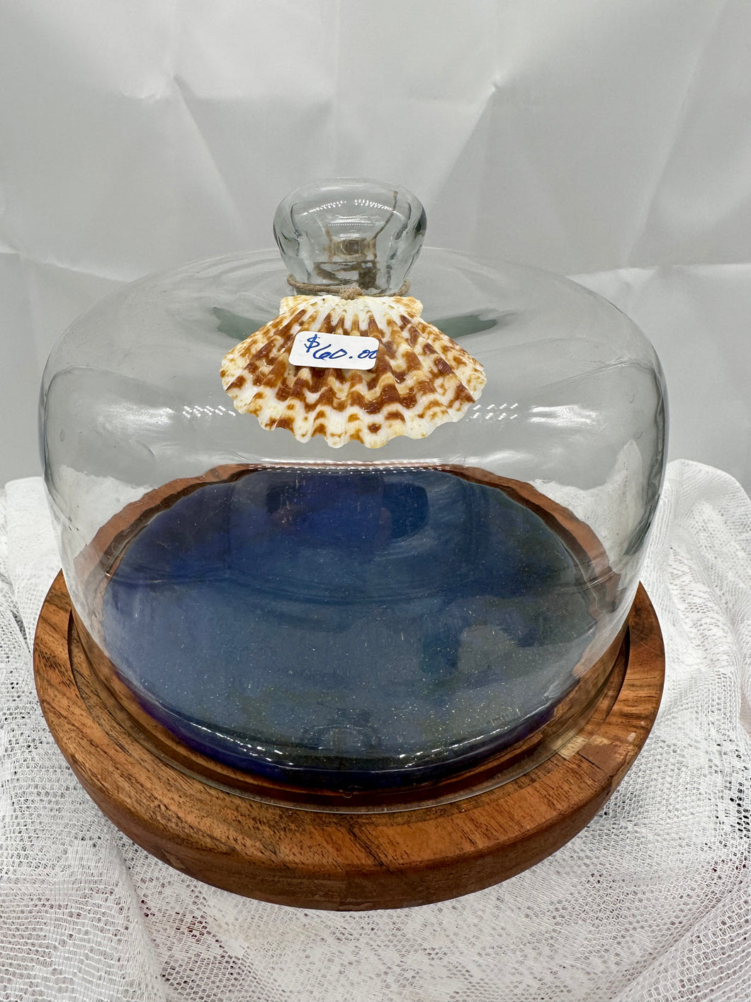 Iridescent blue glass dessert display/adorned with shell
